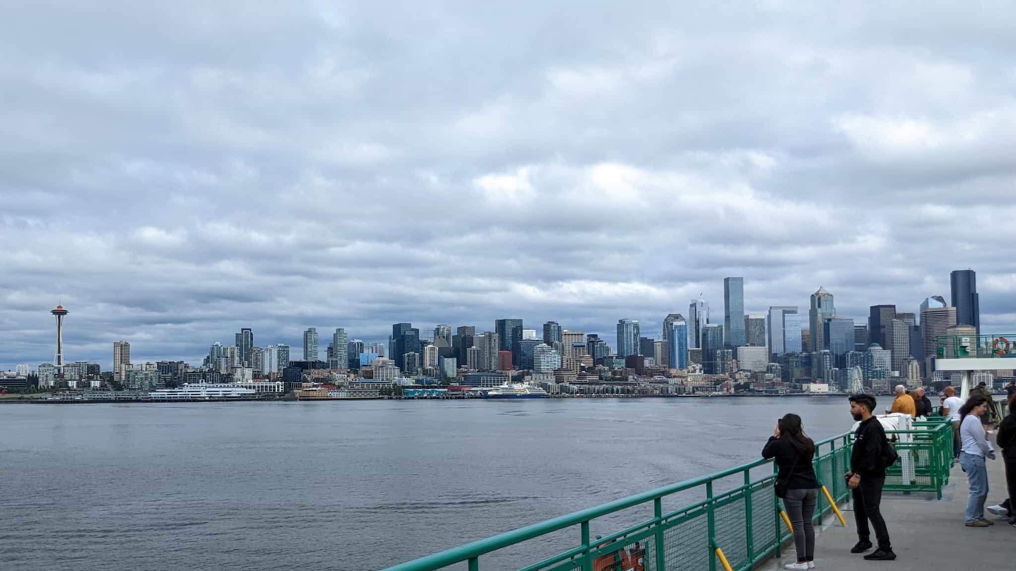Seattle city skyline as seen from a ferry deck on a cloudy day