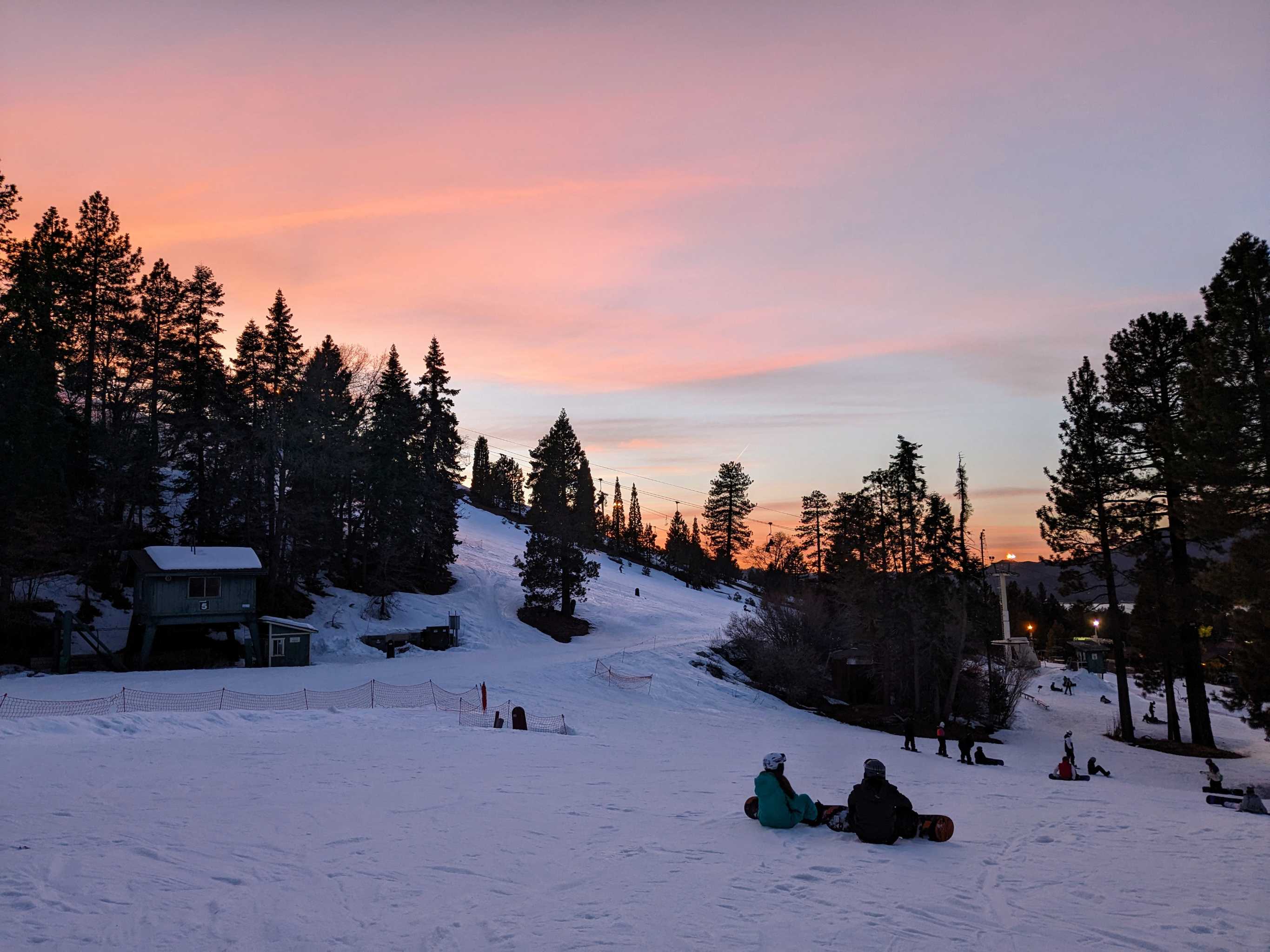 sunset over a ski slope.