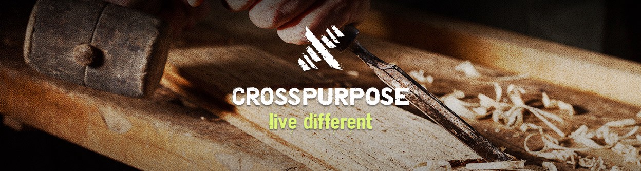 a logo, the words "crosspurpose" and "live different" on top of an image of a person using carpentry hand tools