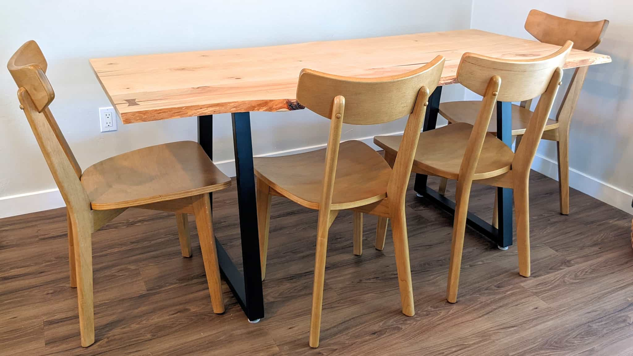 Wooden dining table with metal legs