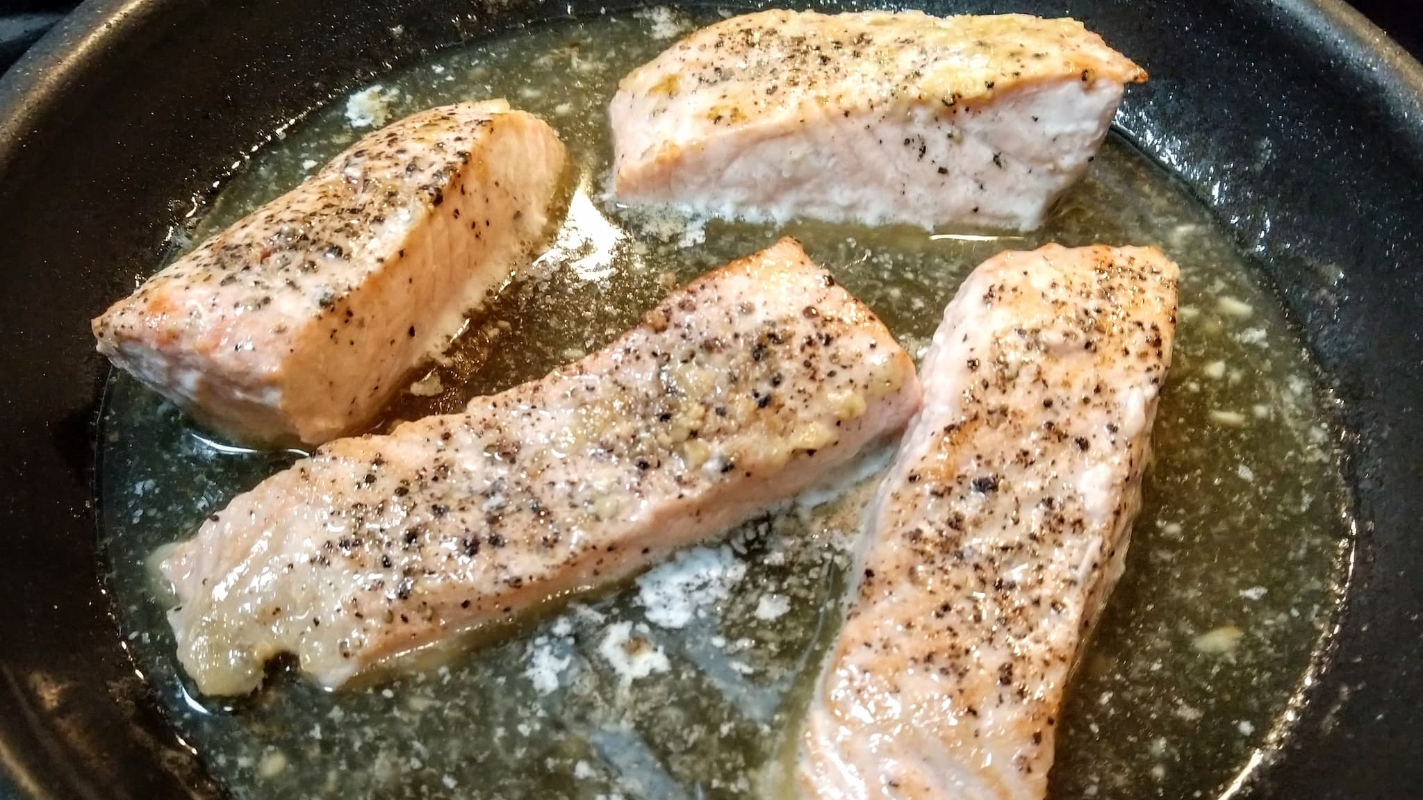 cooked salmon in a pan