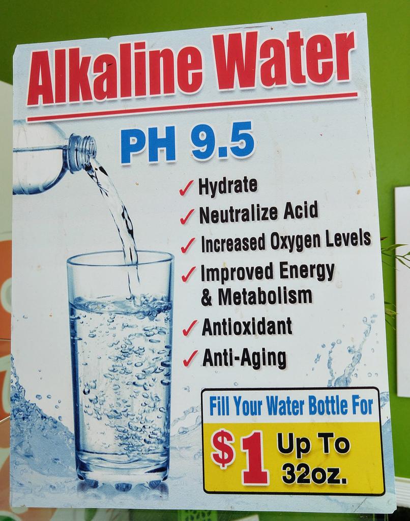 Advertisement for Alkaline Water with a PH of 9.5 and a list of supposed health benefits like 'Anti-aging' and 'Improved Energy & Metabolism'